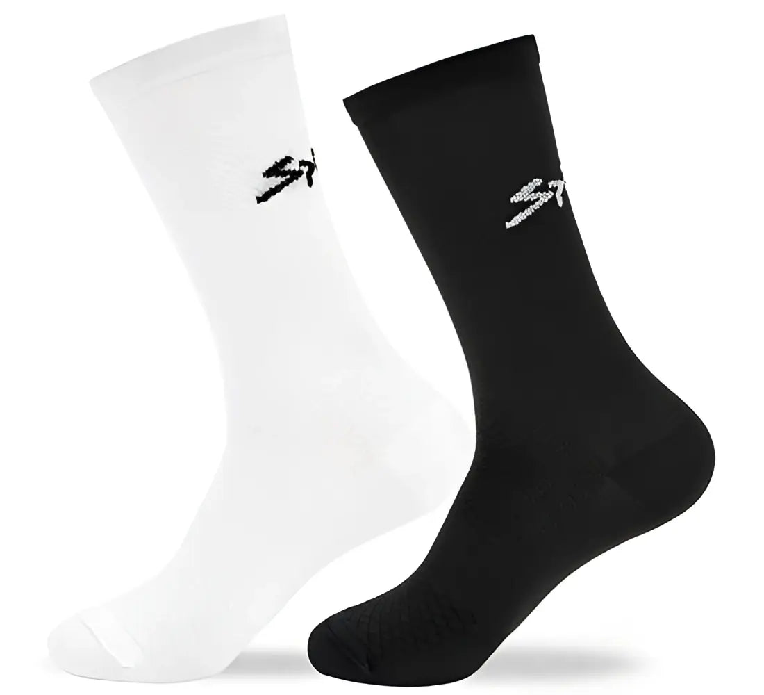 Par de calcetines ciclista ciclismo spiuk anatomic largo unisex en blanco y negro con logo sutil lateral